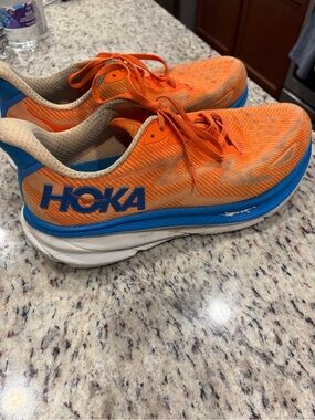 Hoka Men's Bright Orange Running Shoes with Blue Accents